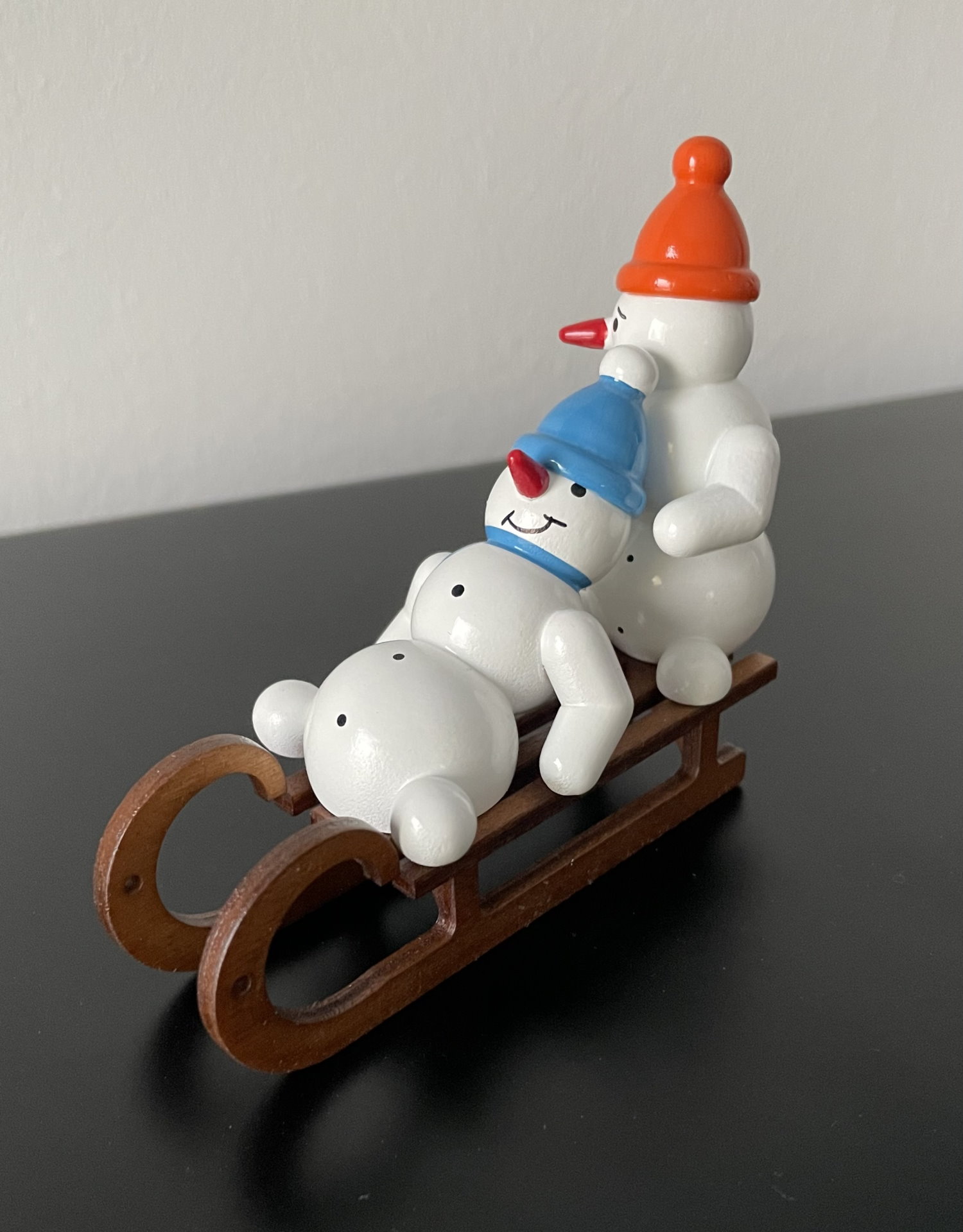 Snowman duo on sledge 7cm decorative figure made of wood