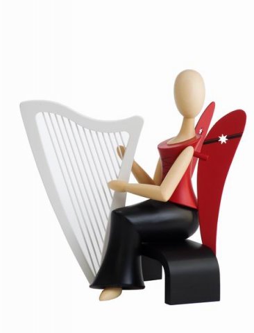 Angel Starhead sitting with guitar